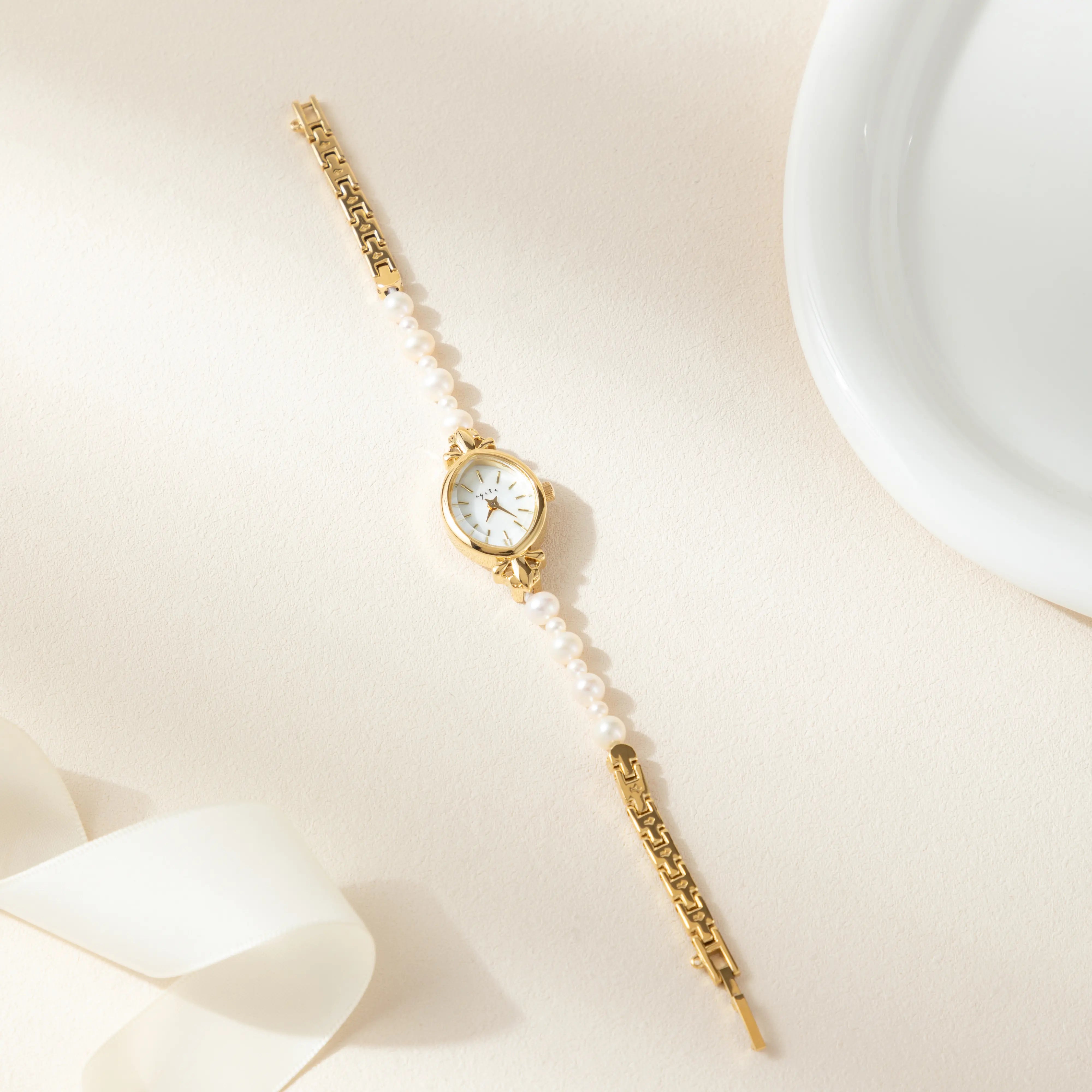 Aurelia – Orologio da donna oro con cassa a forma di goccia