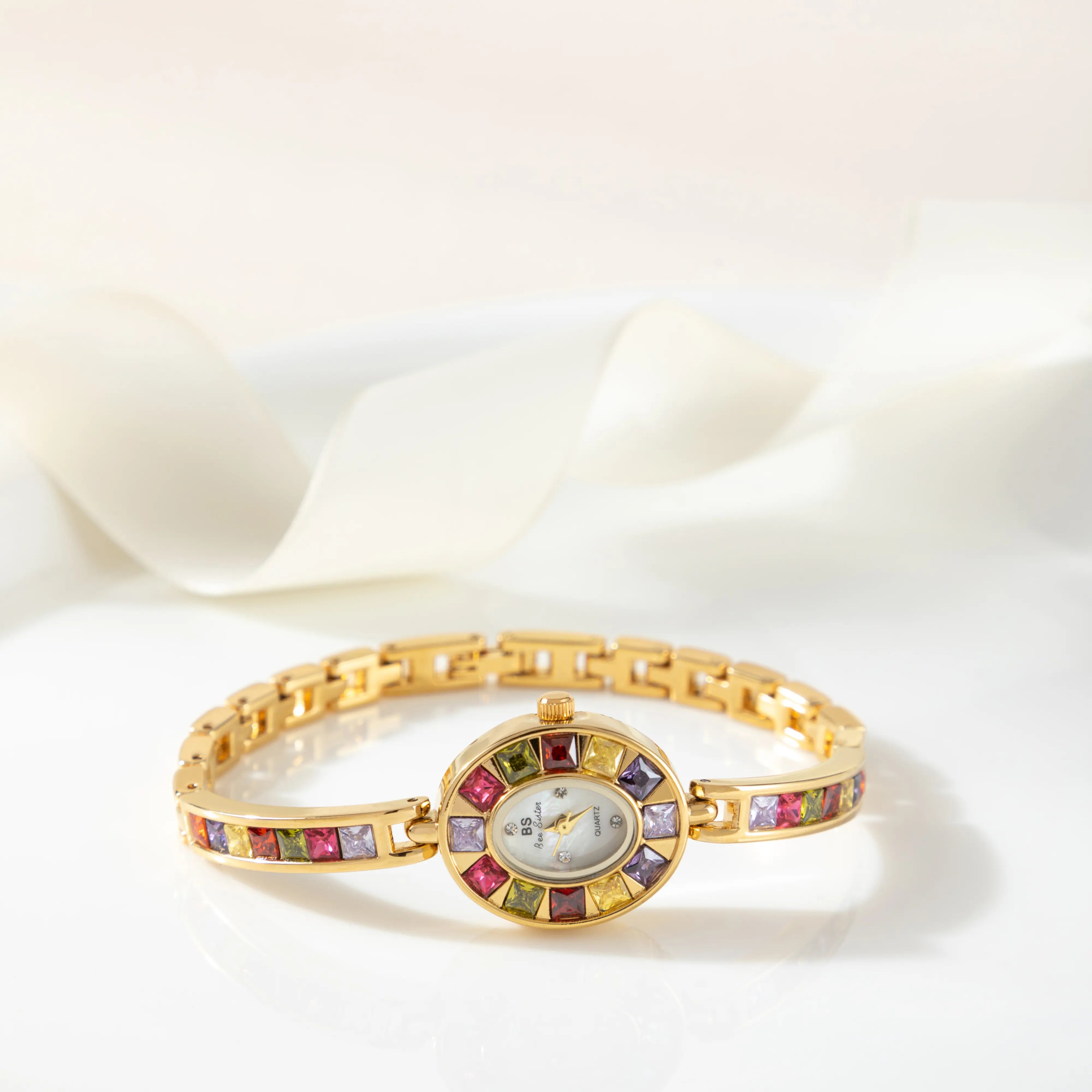 Amélie – Orologio dorato con quadrante in vetro.