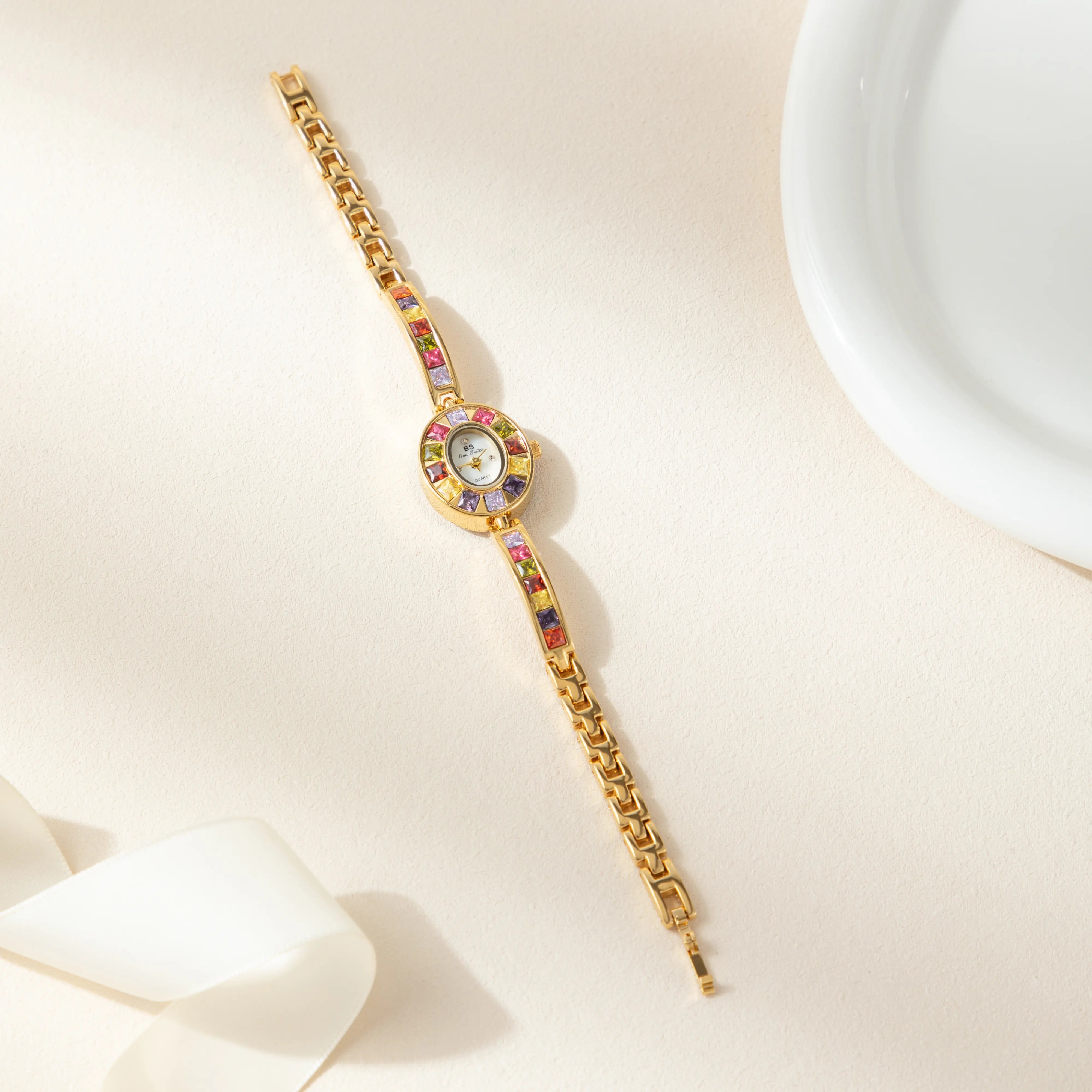 Amélie – Orologio dorato con quadrante in vetro.