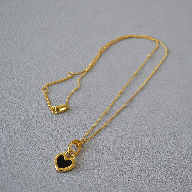 Collana con Pendente Nero e Bianco a Forma di Cuore in Oro