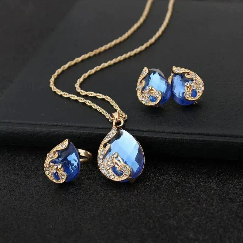 Set Collana e Orecchini in Cristallo Blu con Oro
