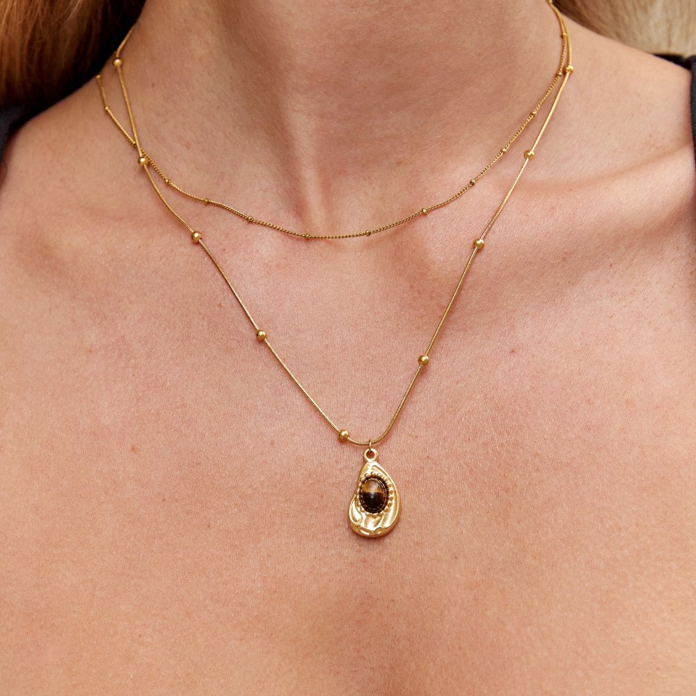 Leonie – Collana con pendente rotondo in oro.